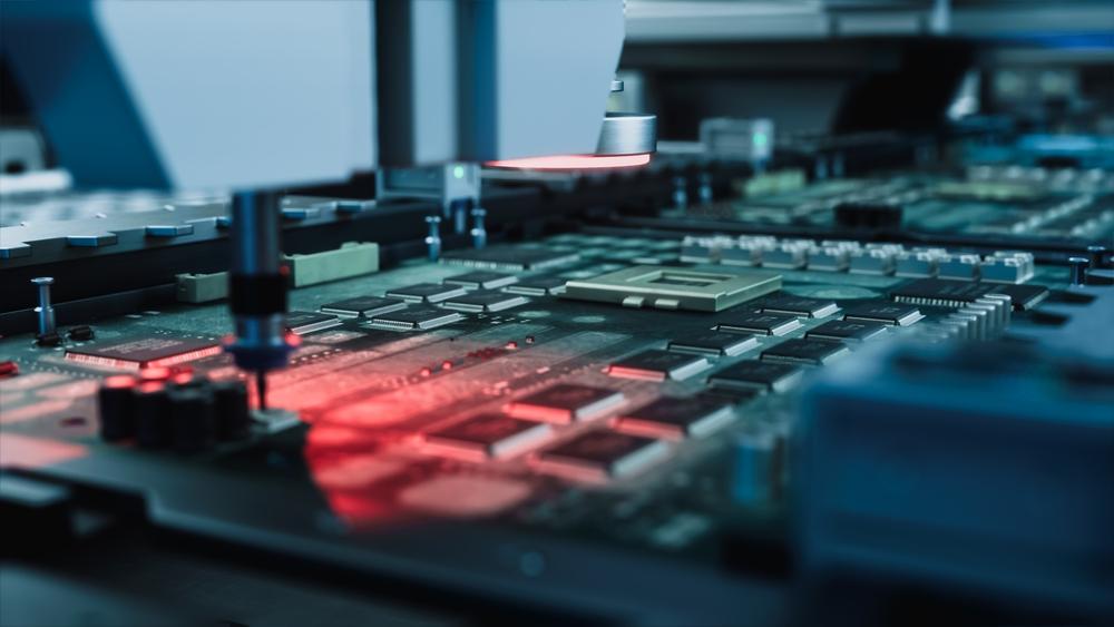 A pick-and-place machine precisely positioning components on a printed circuit board at PPSI